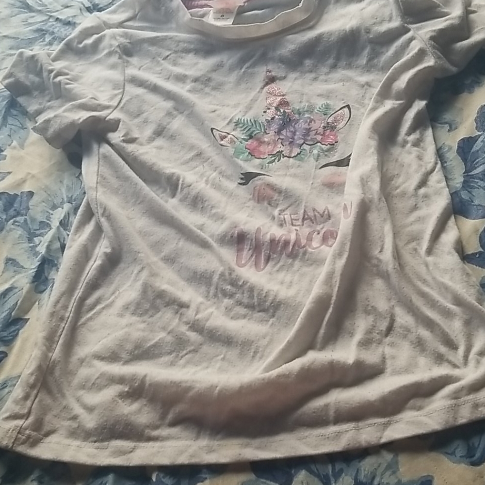 A white unicorn shirt